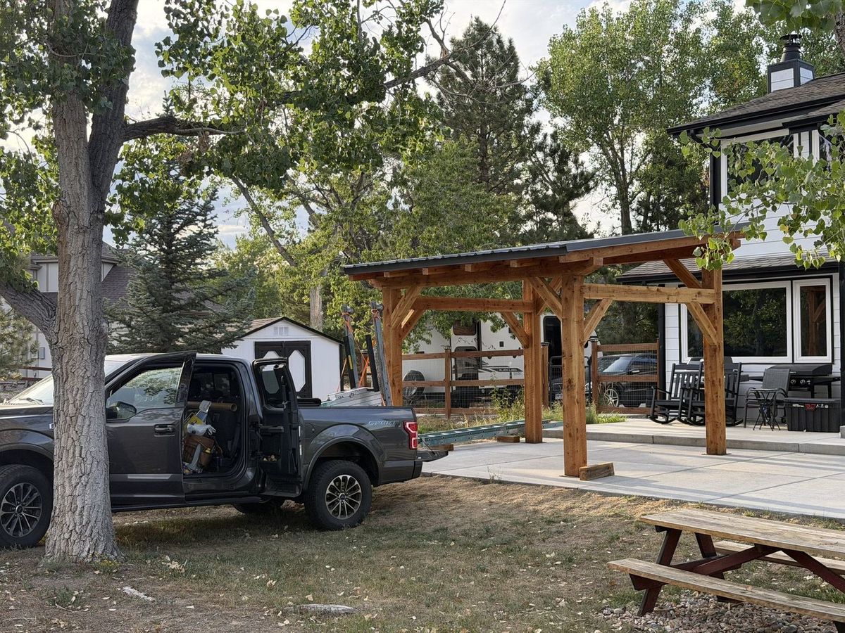 Close-up of hand-cut timber frame joinery on the Arvada pavilion