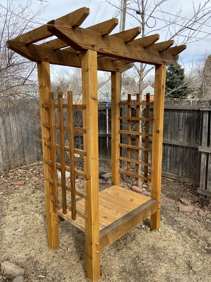 Cedar trellis arbor with bench front view